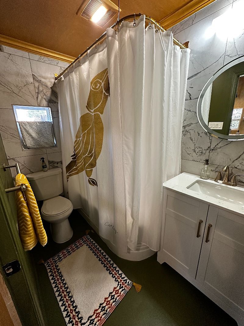 Bathroom with 2 fully tiled walls and plus brand new toilet. 