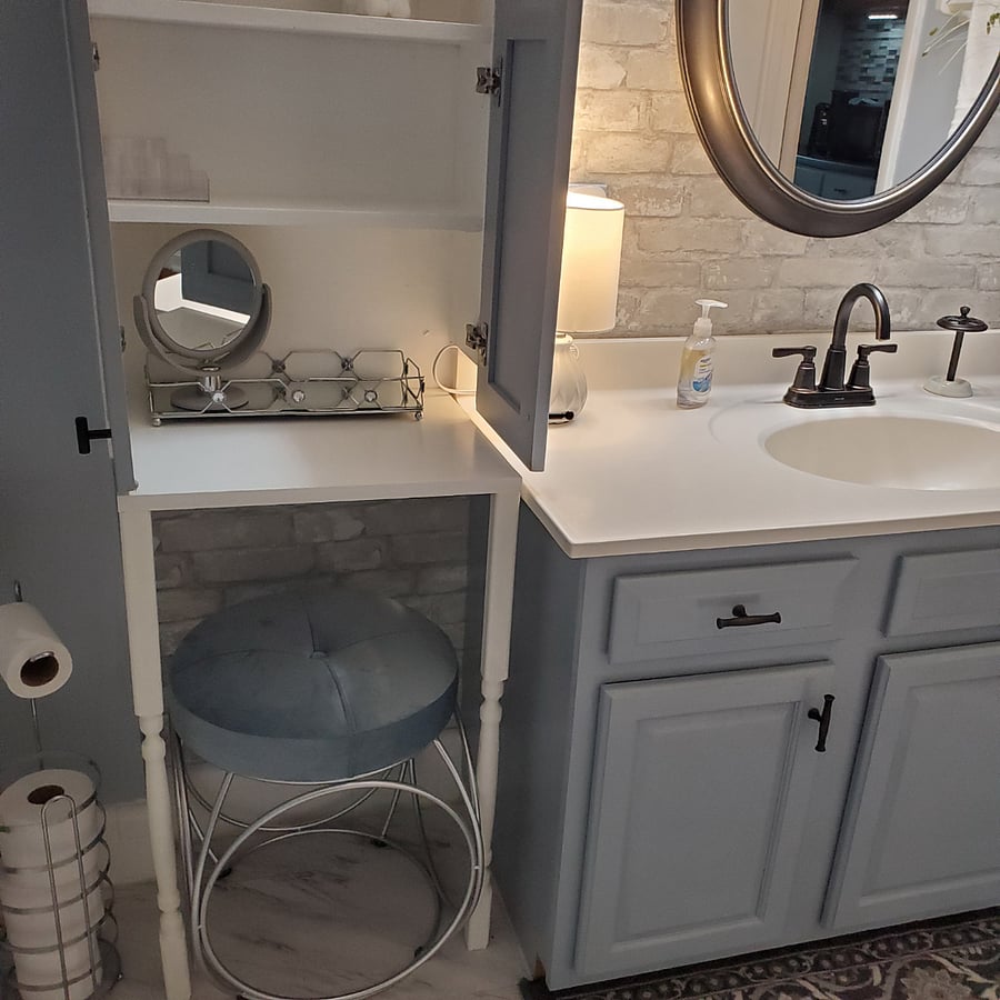 Built-in cabinet with makeup vanity and seating.