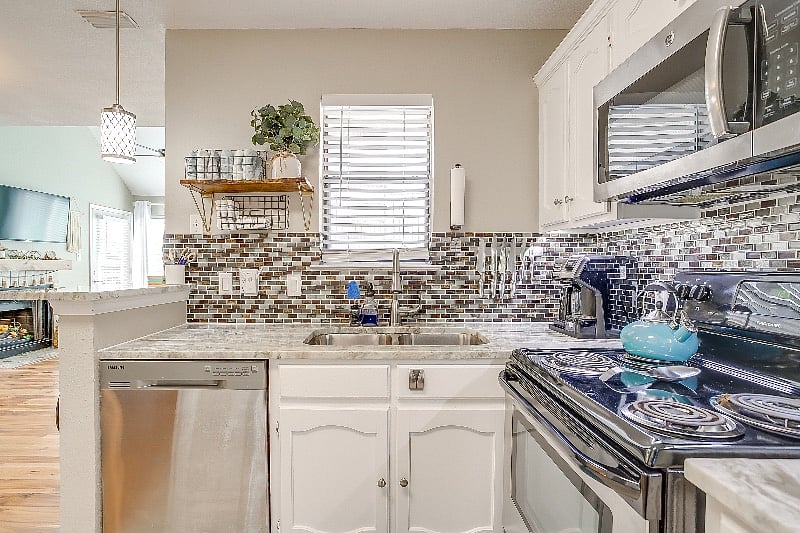 Bright and open full kitchen. Fully stocked for your convenience.