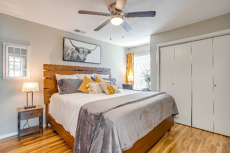 Main level bedroom with a touch of Texas. Comfortable and cozy king size bed with quality linens.