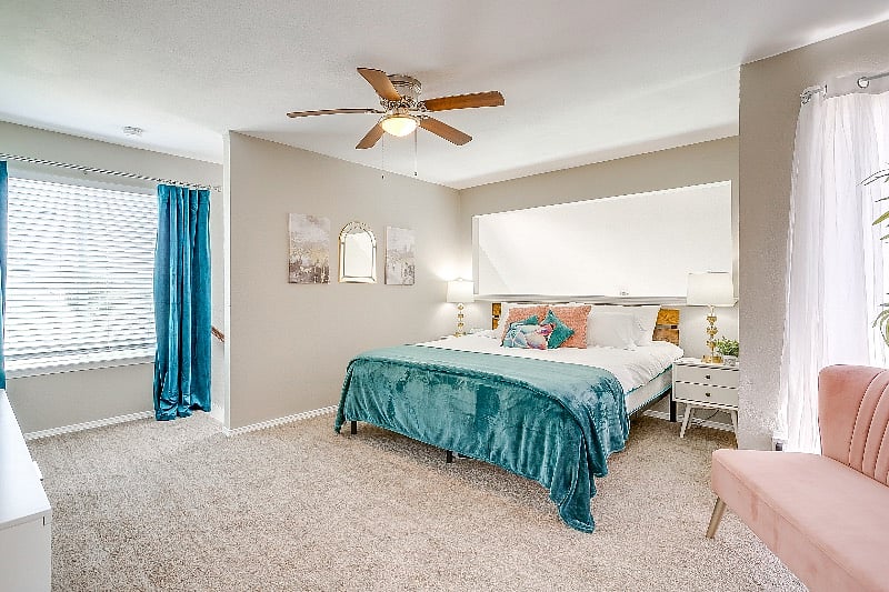 Upper level king bed with quality and cozy bedding.