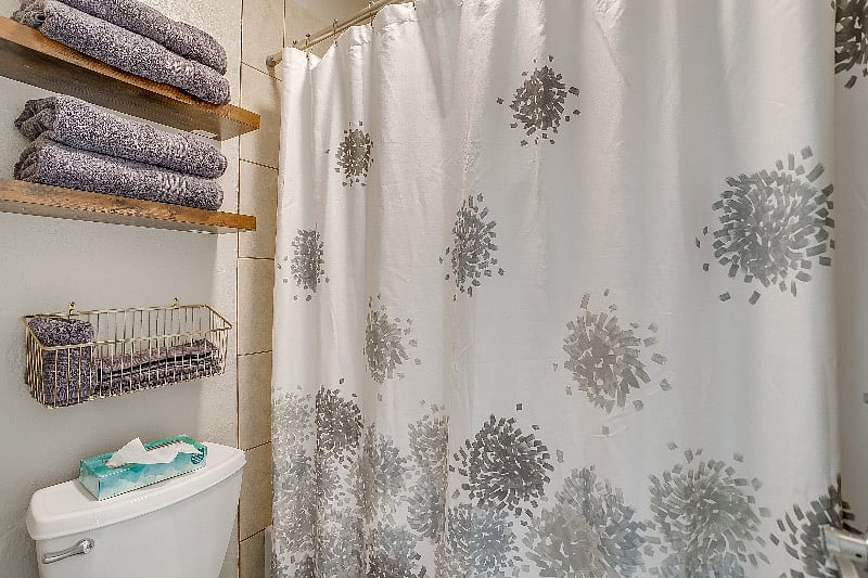 Pretty and well stocked upper level bathroom.