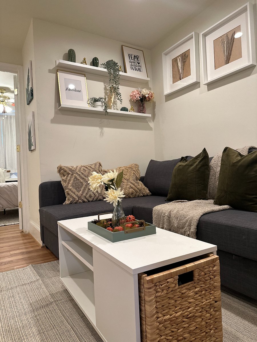 The living space features convenient access to a separate room with a washer, dryer, and extra storage, making laundry and organization a breeze during your stay.