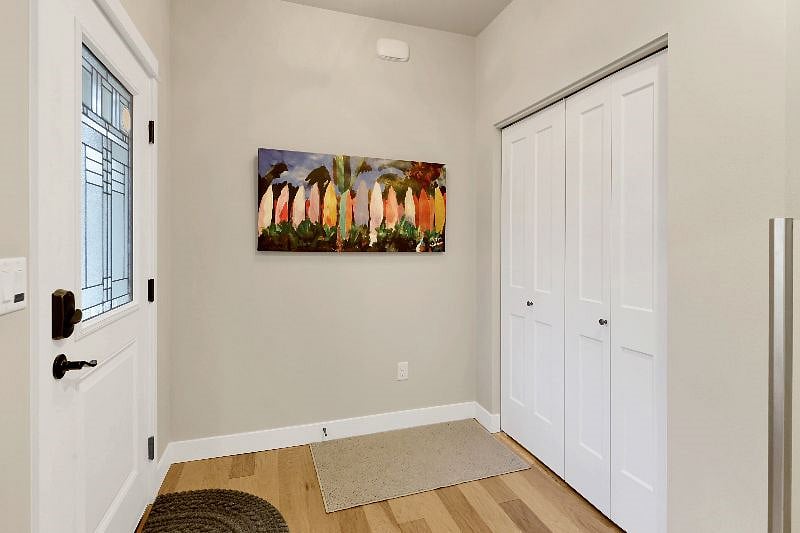 Entry way with coat closet, hangers, and extra storage for your extended stay.