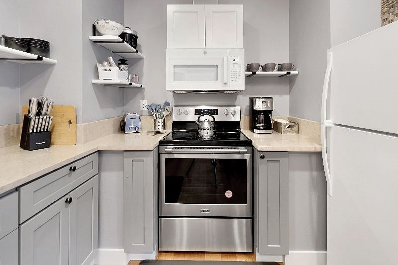 Brand new appliances; over the range microwave, Cuisnart Coffee Maker, rice maker, toaster, blender, and all the pots/pans.cookware needed to prepare a delicious meal.