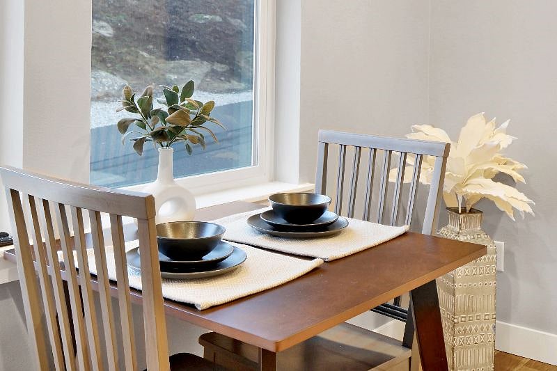 Two person dining table by the window.