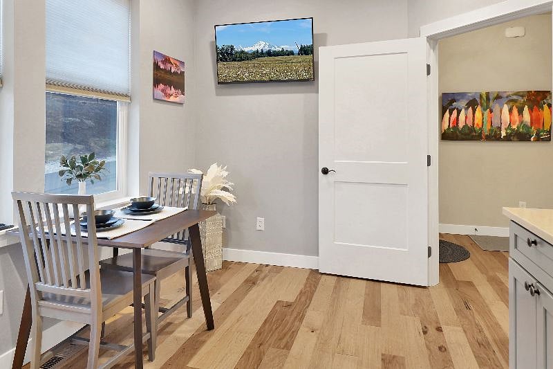 Mounted flatscreen TV so you can catch up on the news or favorite show while making meals.