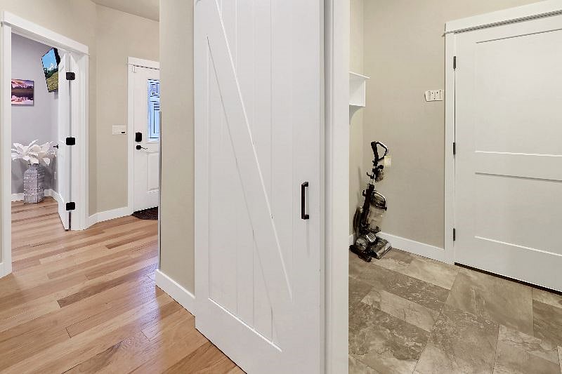 Modern barnyard door going into mudroom.