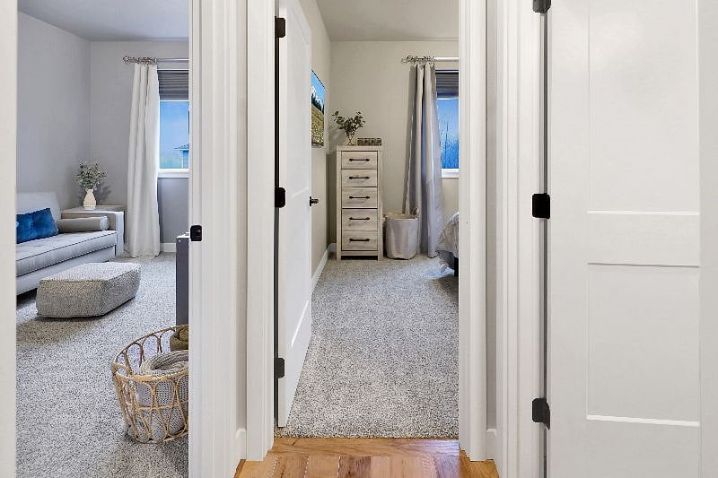 Hallway leading to media room, bathroom, and masterbedroom.