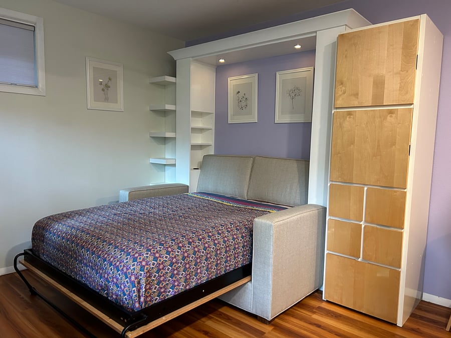Murphy wall bed is very sturdy and custom made. Super easy to open and close, and very comfortable. Has reading lights, outlets, chargers and shelving. I supply several linen options and nice pillows, all high quality.
