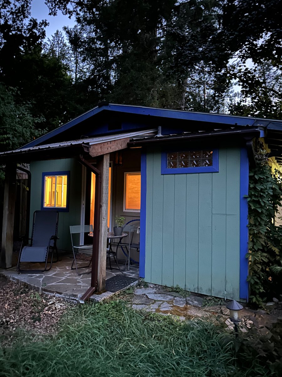 Private rear porch extends living space, great garden view.