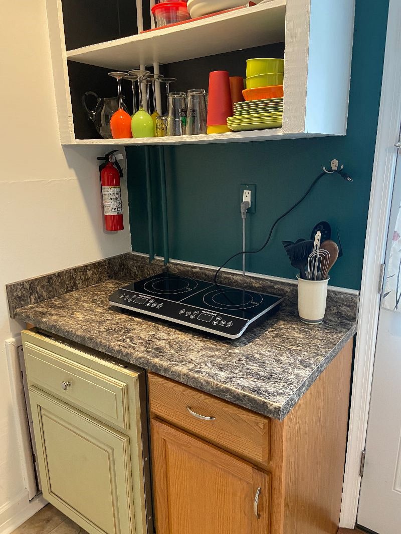 Brand new fire extinguisher for your  safety. Bet you never need it!
Also utensils are conveniently located with the cooktop