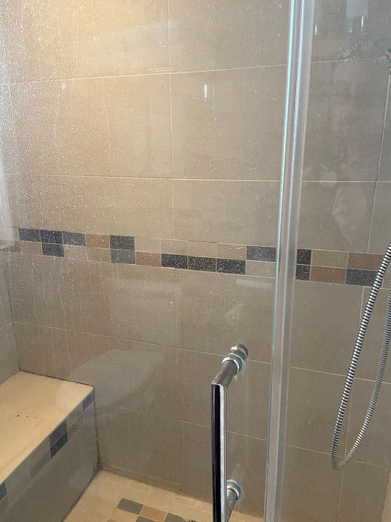 Shower has a seat which is great for when you are shaving legs.