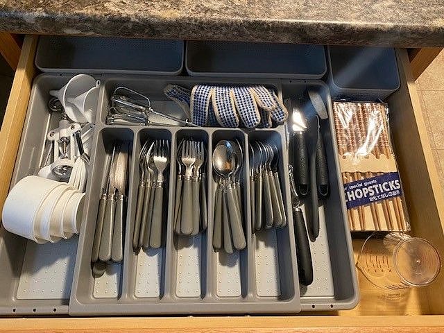 Silverware and baking needs are located in the drawer under the oven