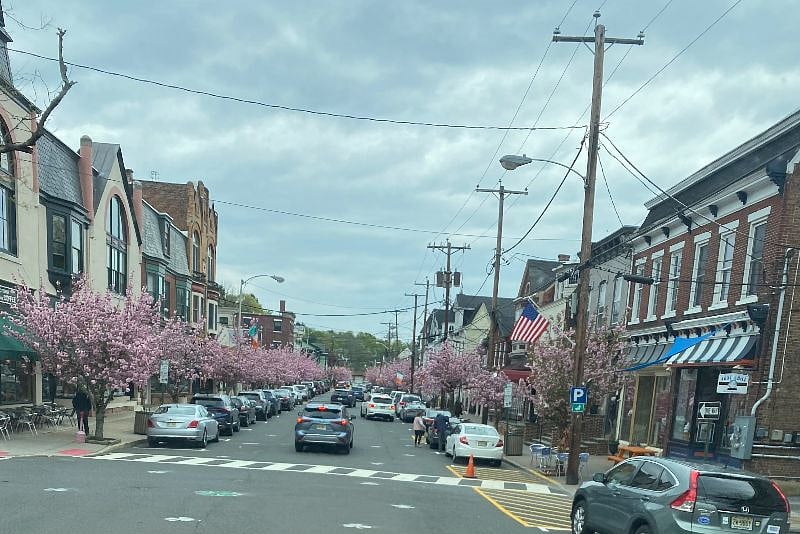 Charming Clinton hometown downtown lined with ornamental cherry trees comes alive on Friday nights all summer.