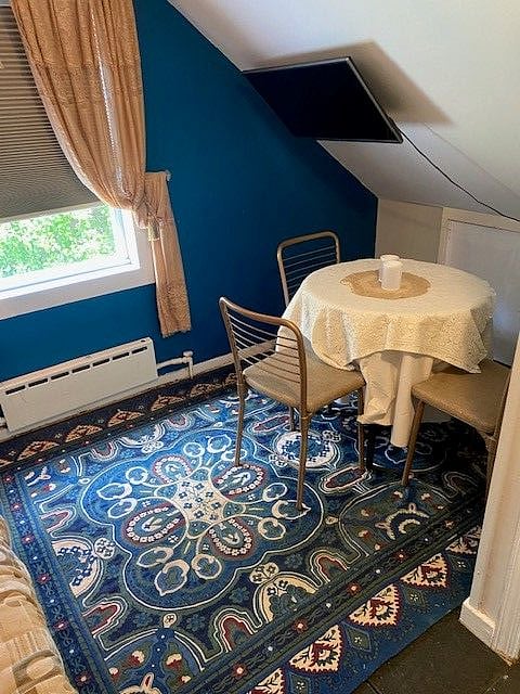 Attention: This additional room is not included in base rent. It is available for additional rental.
Front upper room view of outdoors and table.
