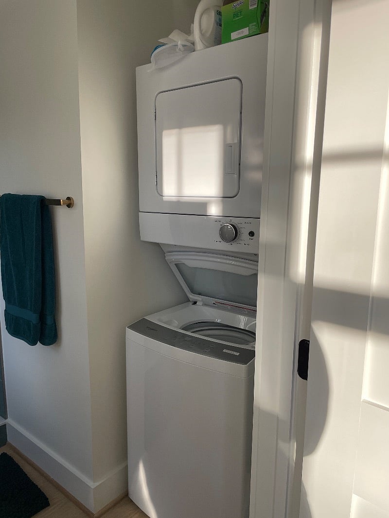 Stacked washer/dryer in bathroom 