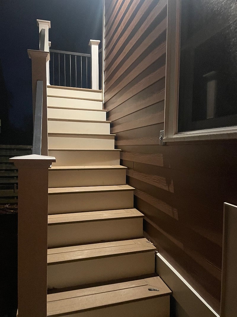 Lit stairs going up to apartment 