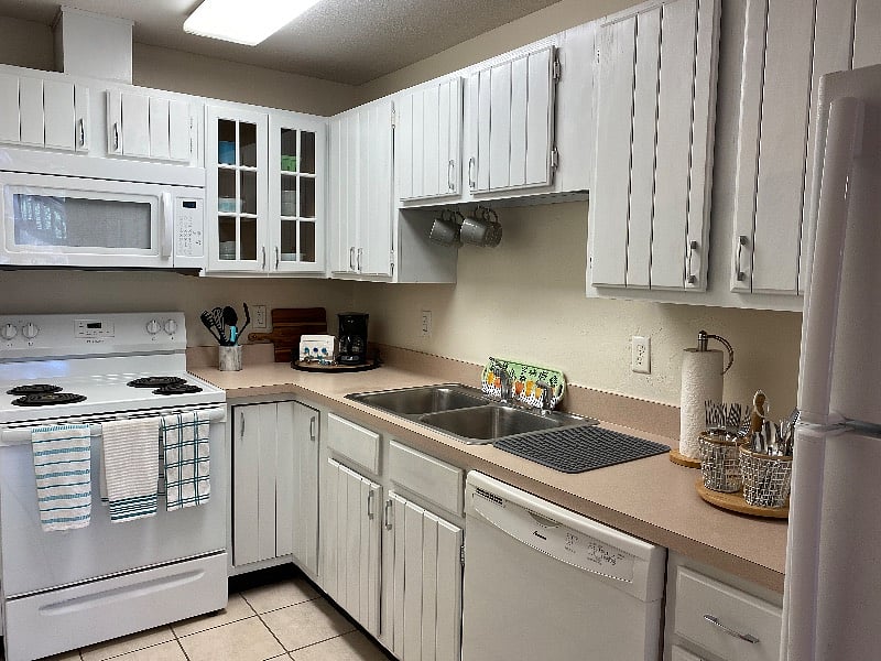 Full kitchen with full-size fridge, stove, dishwasher, microwave
