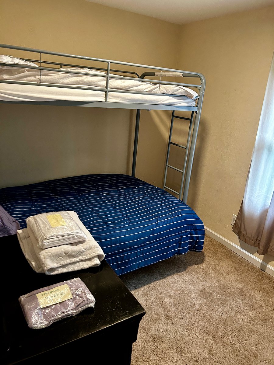 Bedroom #2 Has a Full size Bed/ Couch Combo Bunk Bed with a Single Bed up top with a window facing the front yard.
