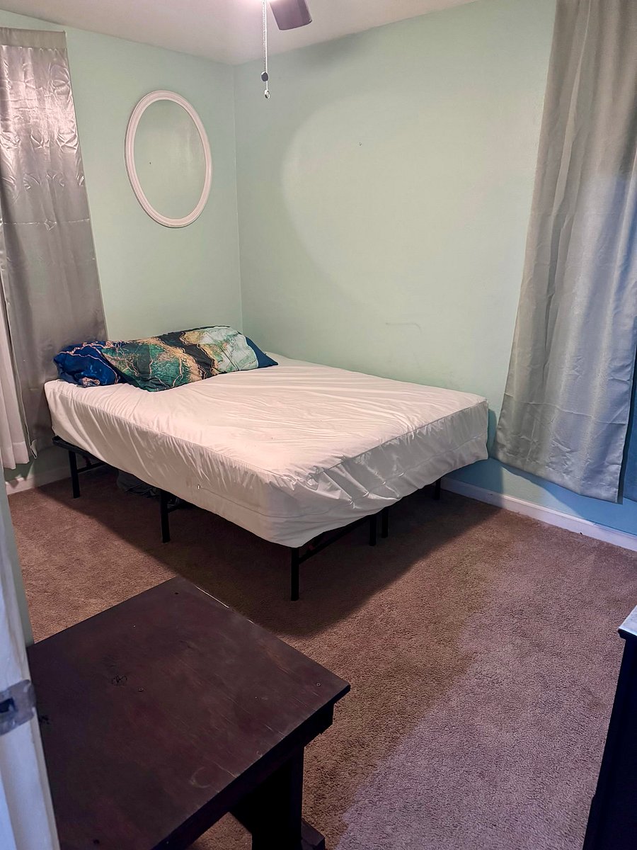 Bedroom three queen size bed with full dresser, full closet smart TV on the wall ceiling fan Furnished