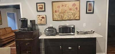 Coffee and tea maker, air fryer, toaster oven, two electric burners, microwave.