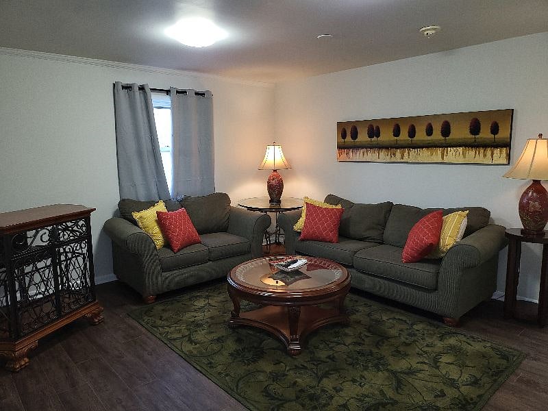 Added some 'warm' colors and comfort to the huge living room. So much space yet so cozy and comfortable. Magnificant bar with stools for a night cap of your choice.