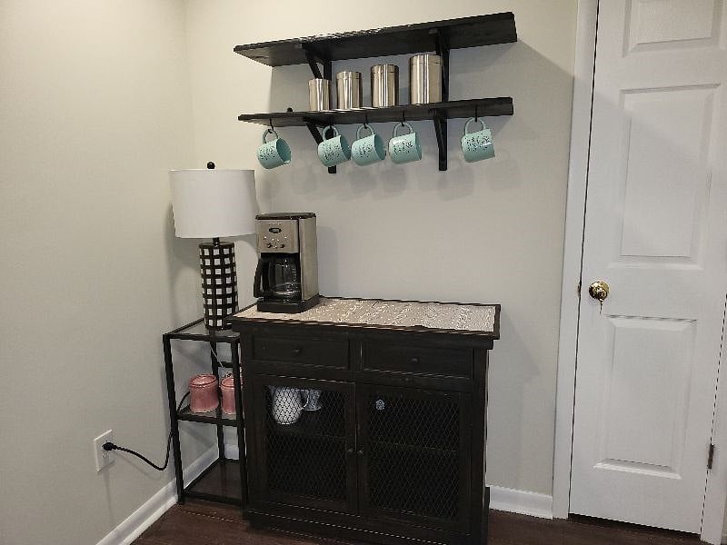 Adorable coffee bar nook with custom hand made 'barnwood' shelving.