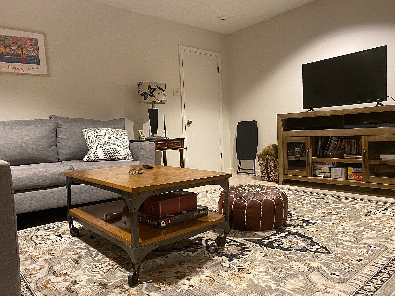 Formal Den great space for private work area second TV room with board games and books for leisure reading.