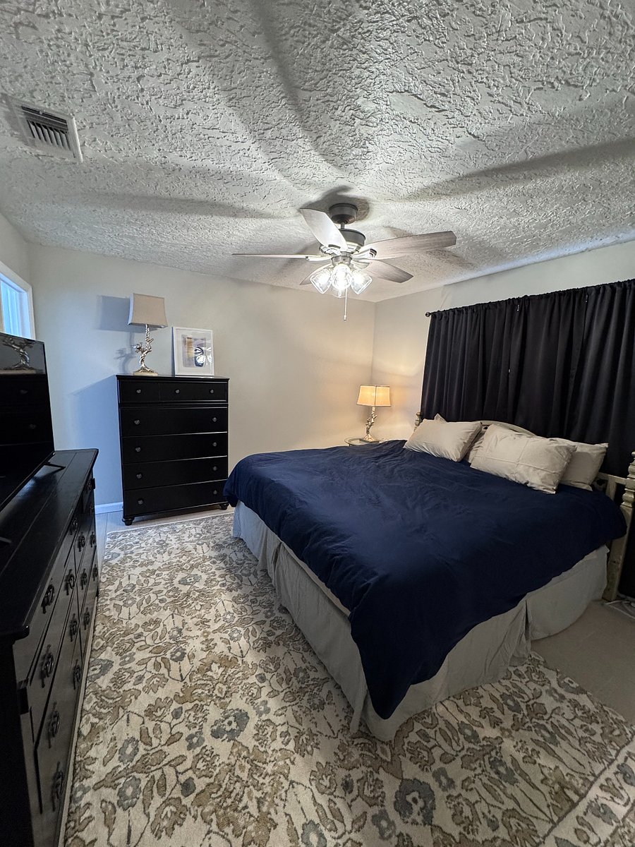 Primary bedroom with ensuite bath and walk-in closet.