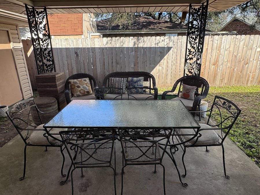 Back patio with outdoor dining table 