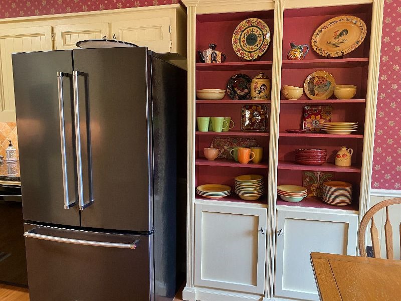 New KitchenAid refrigerator with ice maker and water dispenser.