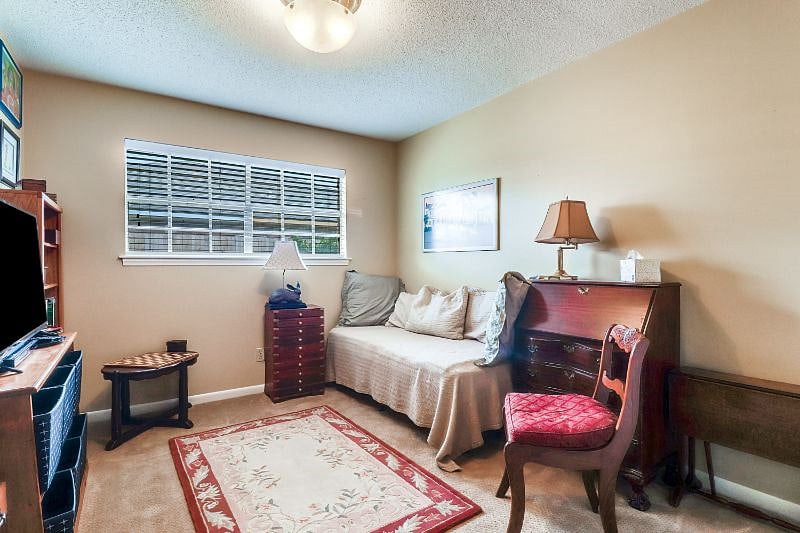 Second bedroom is set up as TV/Game room with a twin bed for overnight guests.