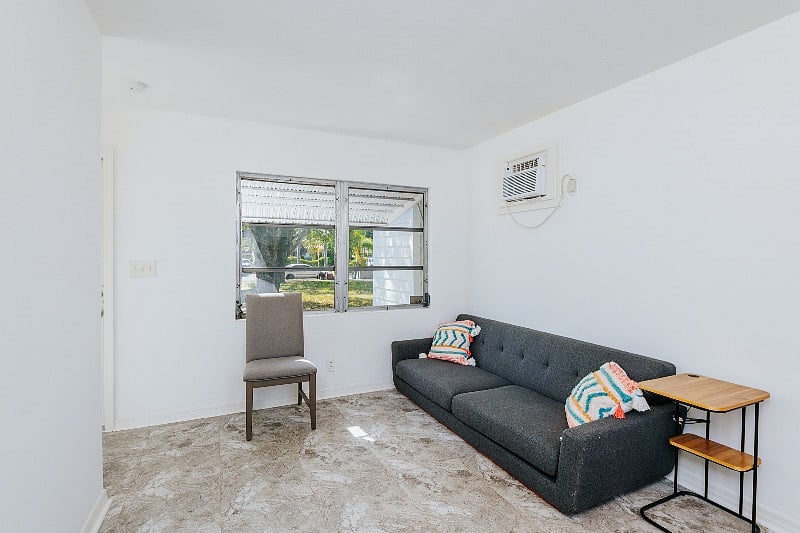 Main living space. Note delivery delay with dinning table and rug