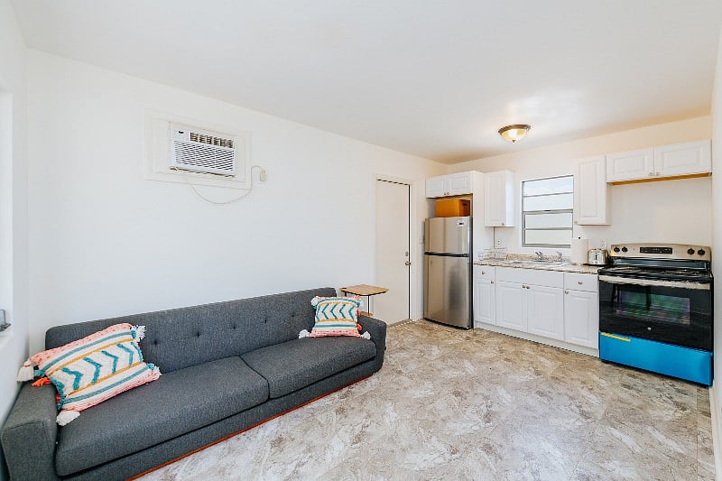 Main living space and kitchen all new kitchen and appliances . Note delivery delay with dinning table and rug