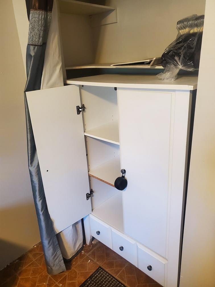 Armoire in left closet
