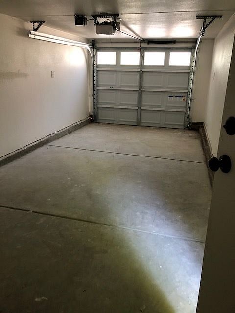 Garage accessed from Uptown Alley. Side door leads to lower patio and stairs
