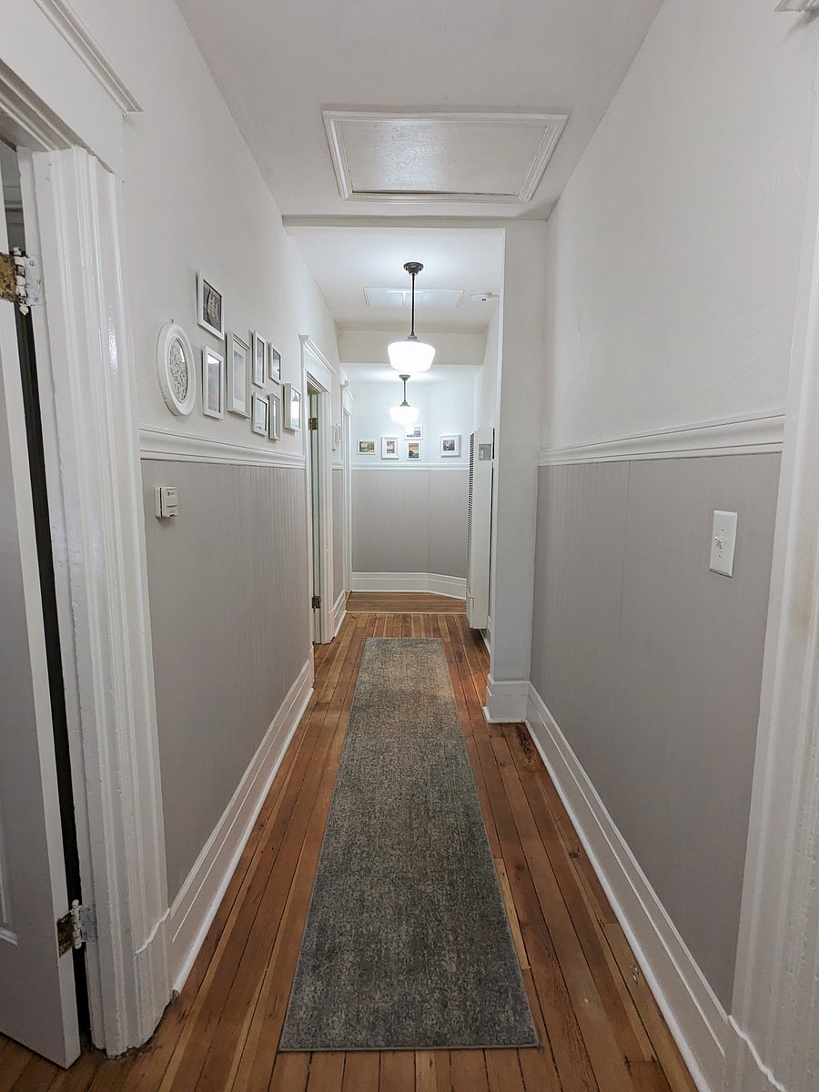 Hallway between the great room, the three rooms, and main bathroom.