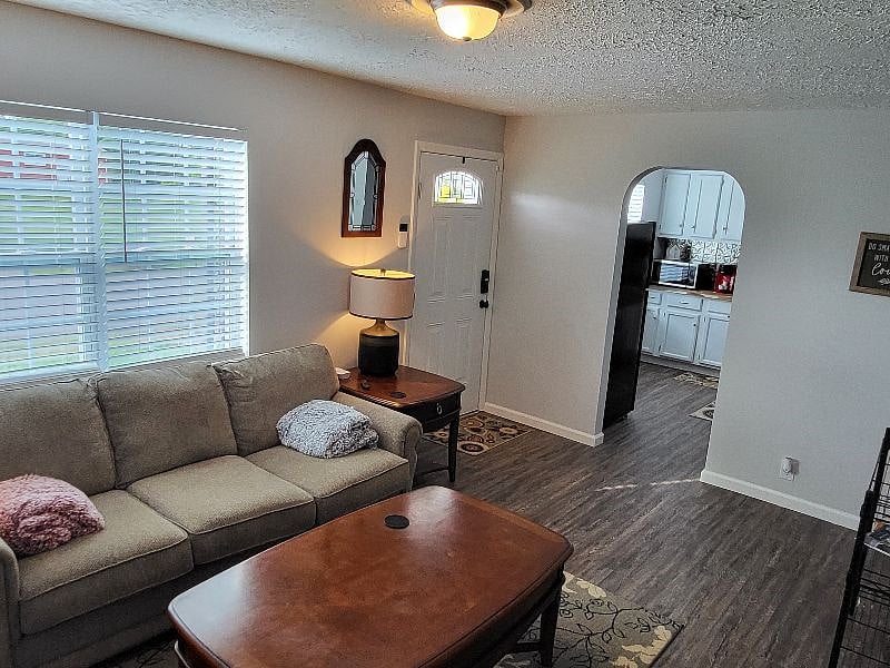 Comfy couch and large smart tv in livingroom. Throw blankets to cuddle on couch and watch tv.