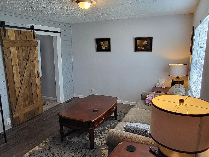 Comfy couch and large smart tv in livingroom. Throw blankets to cuddle on couch and watch tv.