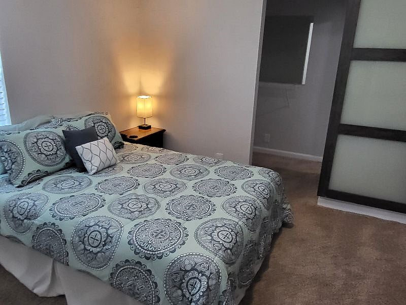Bedroom 1 - queen bed, spare bedding in closet, night stand and large dresser. Also a large closet in this room. Both bedrooms are jack & jill style where both rooms have direct access from room to bathroom.