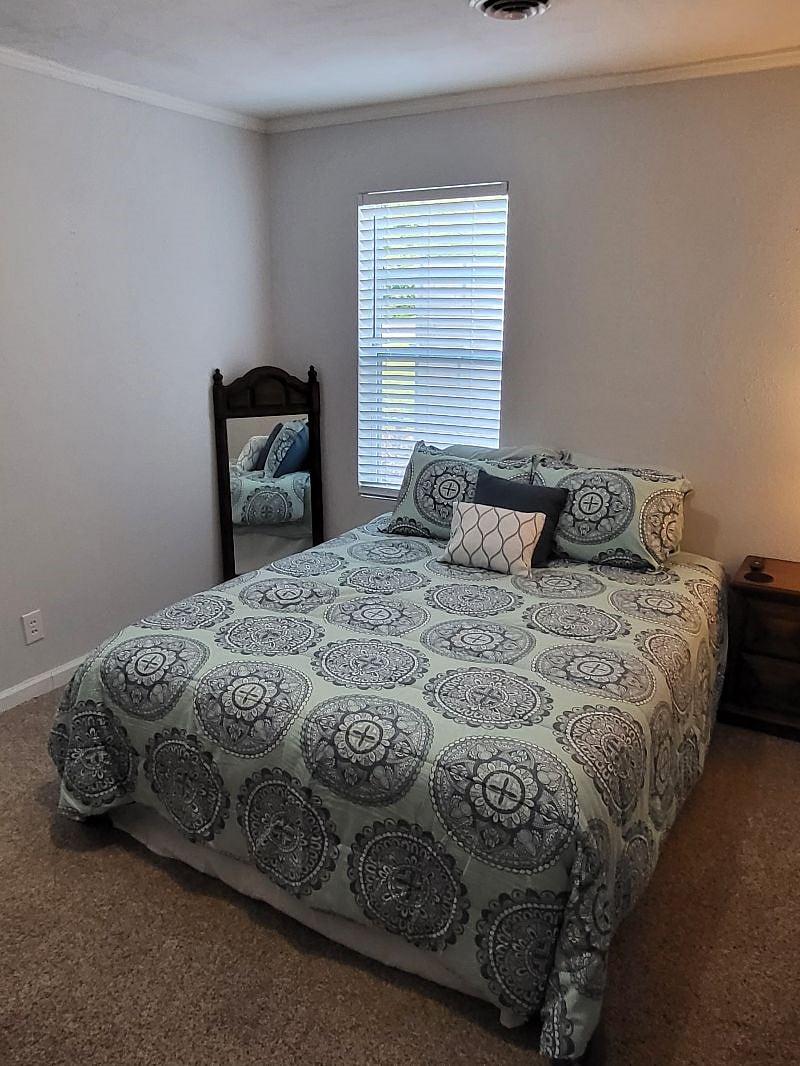 Bedroom 2 - queen bed, spare bedding in closet, night stand and large dresser. Closet in room. Both bedrooms are jack & jill style where both rooms have direct access from room to bathroom.