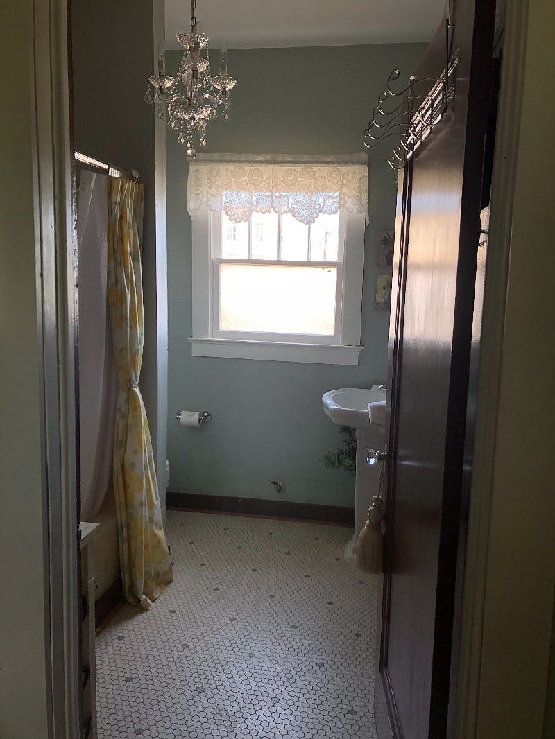 3-piece Bathroom with tub/shower, sink, commode. Storage cabinet, medicine cabinet. Supplies include toilet tissue, (4)bath towels, (4)wash cloths, (1)red makeup washcloth, (1)hand towel, hand soap, body wash/shampoo. Serviced weekly.