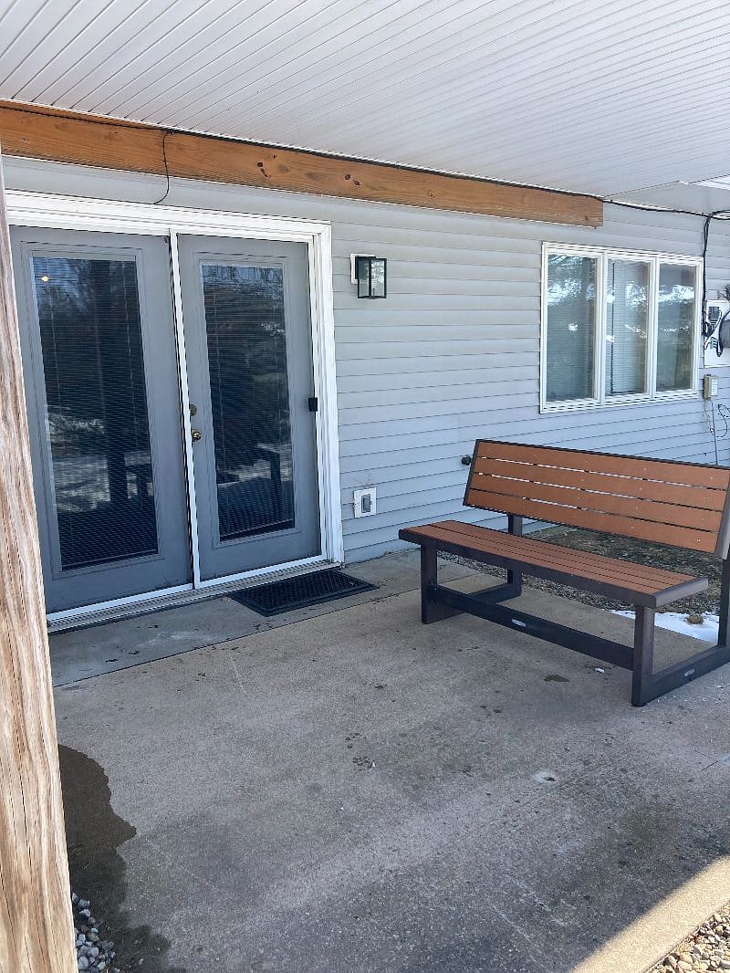 A patio picnic table converted to a bench.