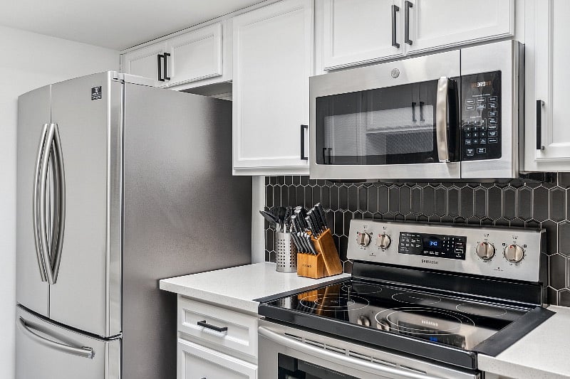 Newly renovated kitchen with newer appliances and quartz countertops.