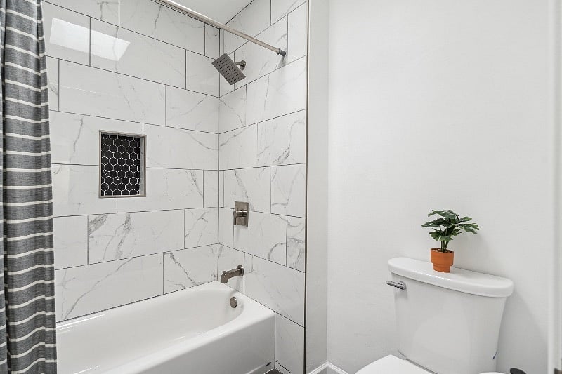 Newly renovated primary bath/shower with skylight.