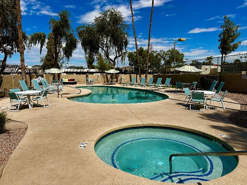 Community pool with new pool furniture and jetted hot tub. The pool decking was also just resurfaced.