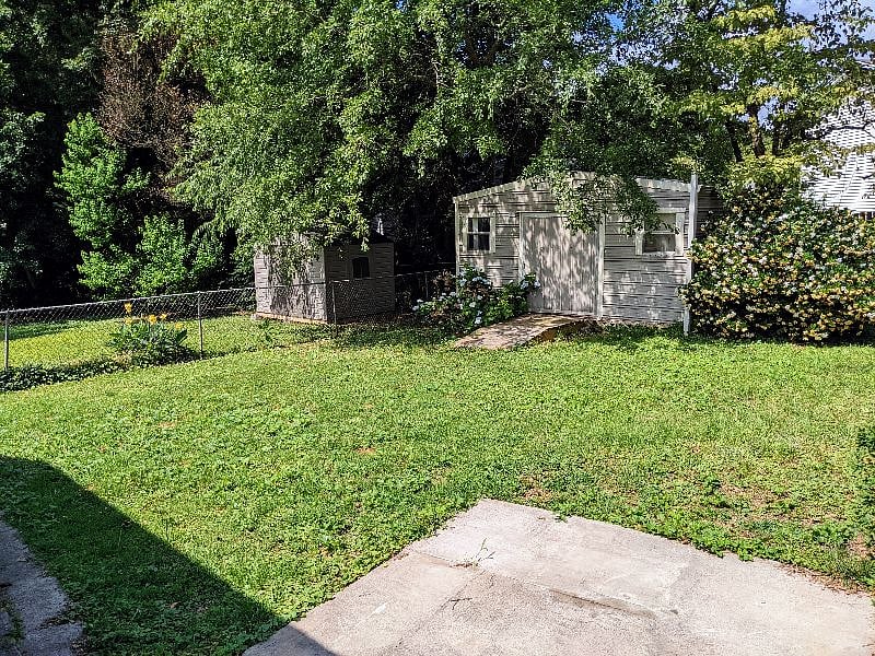 Partially fenced in backyard separated from the other unit
