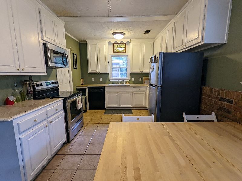 Huge kitchen with half bath off the left side!