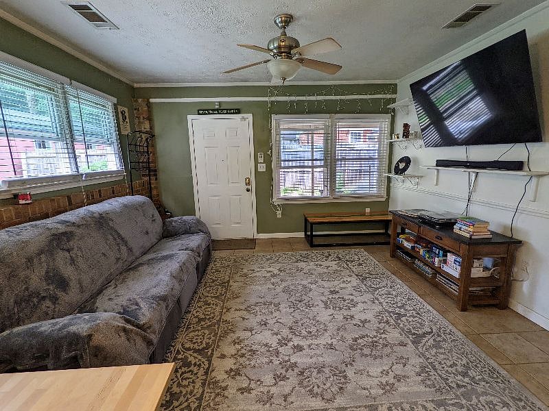 Roomy and bright living space! This photo is taken from the kitchen so it's fully open with the kitchen.